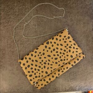 Fold over handbag with long chain strap
